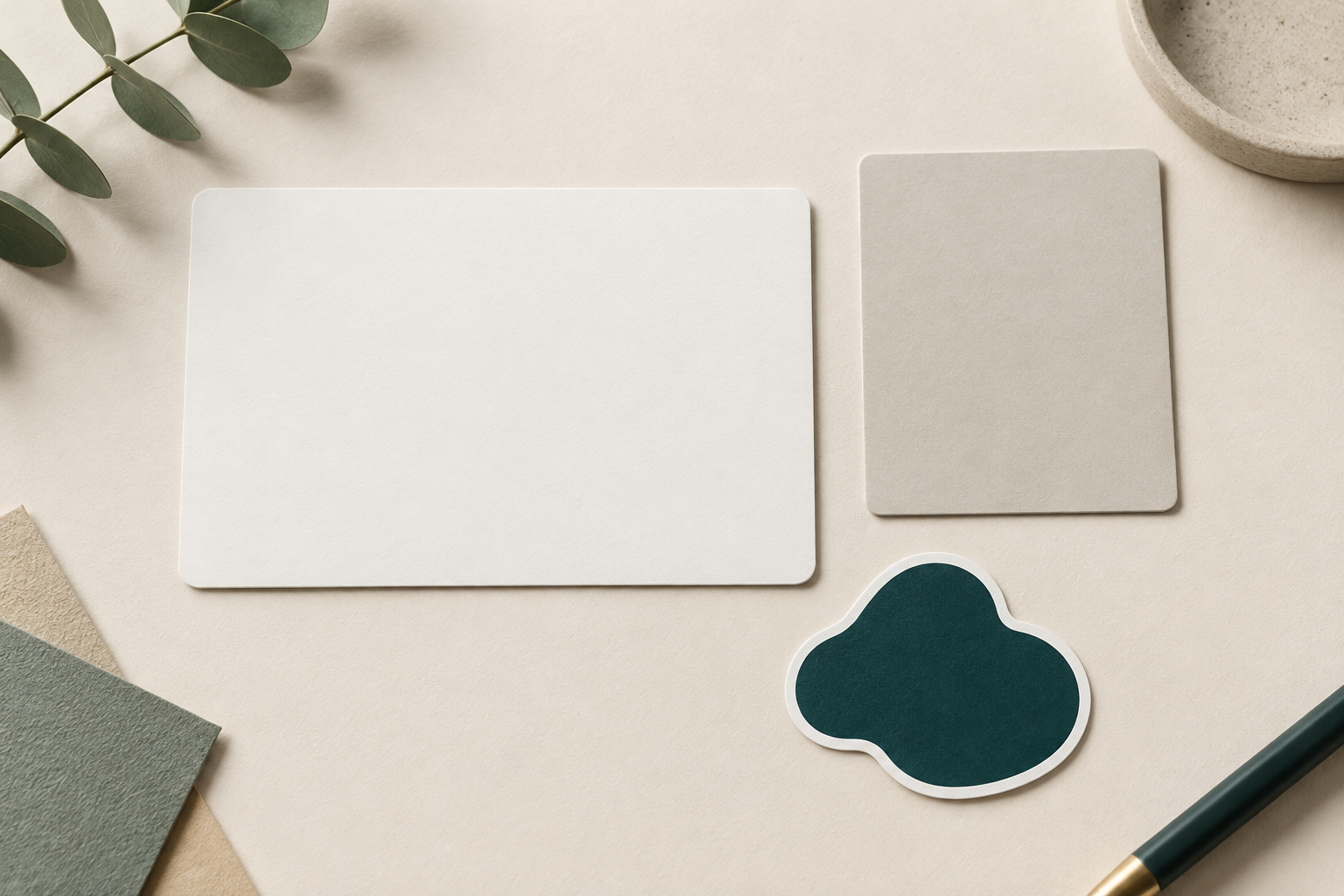 Blank handoff cards beside an unbranded die-cut sticker shape concept