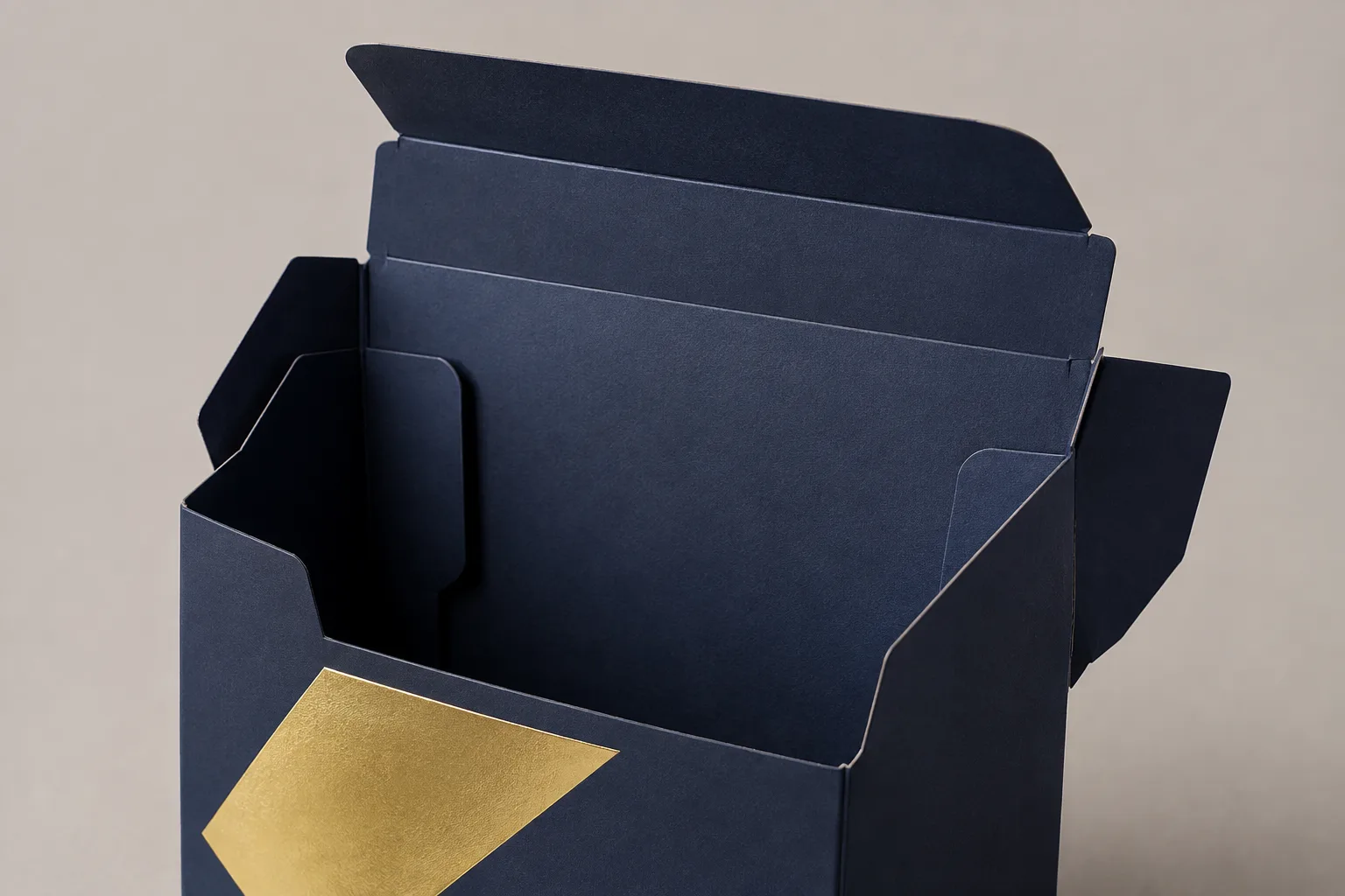 MUGE design-direction concept showing open paperboard display-carton flaps with a blank gold foil panel