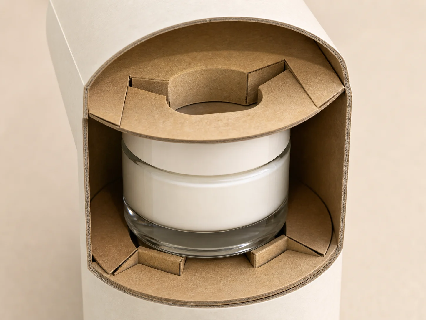 Close-up MUGE design-direction concept showing separate die-cut paperboard end supports inside a paper tube