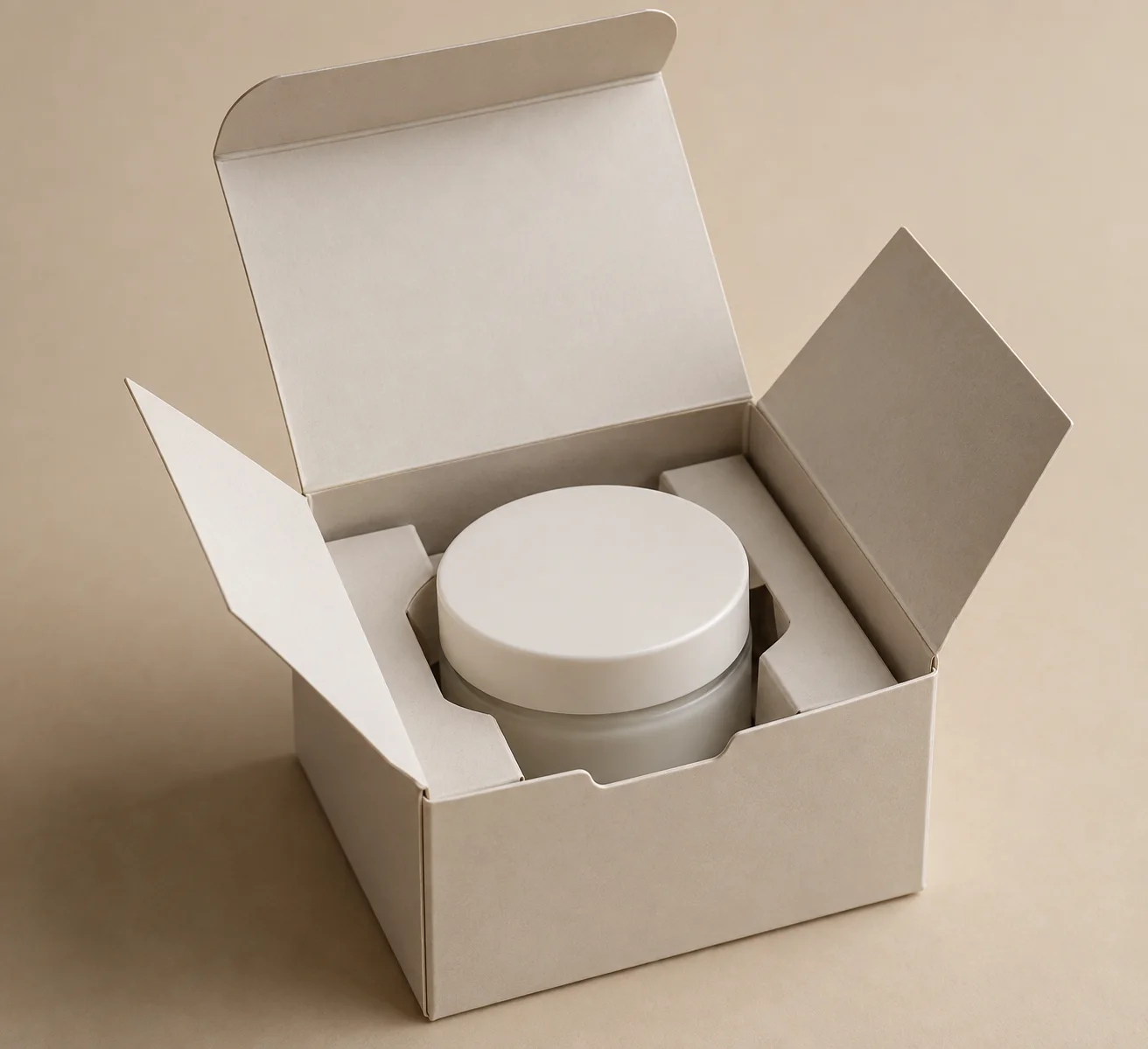 MUGE design-direction concept showing an open folding carton and a generic cream jar seated in a paperboard collar